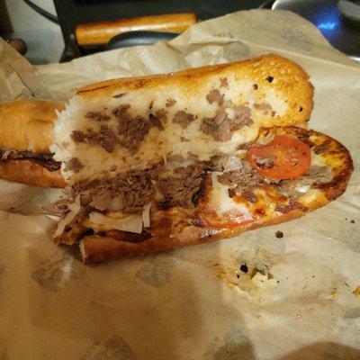 marco's steak and cheese sub with lettuce tomatoes and onions