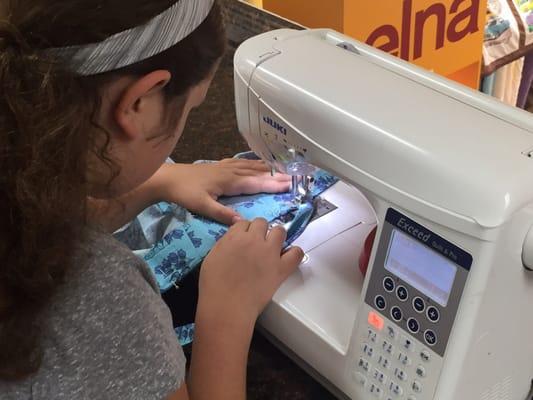 Kids learn to sew, during our After-school Classes and Summer Camps  1st Project - Pull-String Bag.