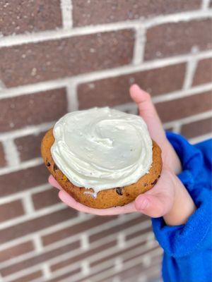 Seasonal pumpkin chocolate cookie with cream cheese frosting