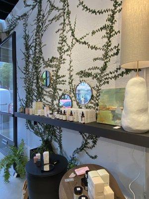 Mirrors, lighting, candles and oils. Live ivy-like plant growing up the wall indoors is a unique design element