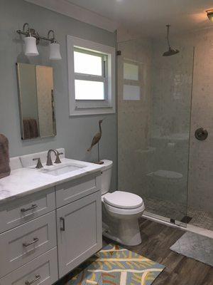 Mirrtique, Inc. Mirror & Glass Co. installed this custom 1/2" clear temp. Splash guard for this shower in Wellington.