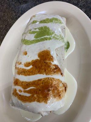 Burrito of any choice of meat topped with queso dip red sauce and green sauce !