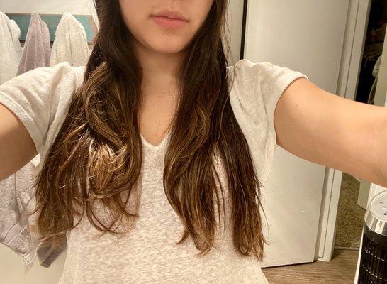 One side has more shorter layers than the other. All my hair is split in half. I parted my hair down the middle for reference.