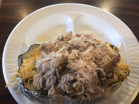 Pulled smoked chicken baked potato. $$$