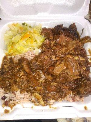 Brown stew chicken with rice & peas and steamed cabbage