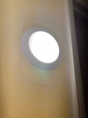 Newly installed LED light that replaced the old wall fluorescent light. (We need to re-paint which is totally fine).