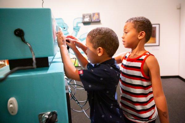 Let the kids tinker at Robo Art, showing now through Jan. 2, 2022.