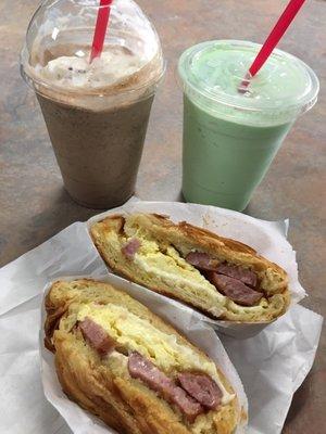 Drinks: Java chip with whipped cream and green tea Sandwich: sausage, egg, and cheese croissant