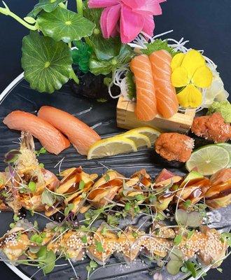 Sex on the Beach and Out of Control rolls with smoked salmon, spicy tuna and salmon sushi.  Yum!