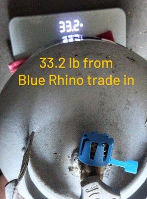 The blue rhino exchange tank weighed 2 lbs less than the 76 station refill tank.