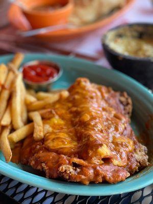 Chicken Fried Steak topped w/ a Cheese Enchilada and Chili Con Carne. Crazy combo, but Oh so Good!