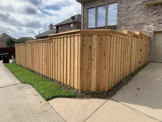 Custom Western Red Cedar fence with a "step and level" approach to grade.