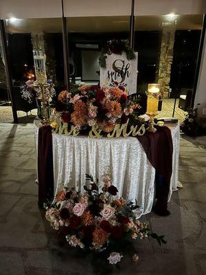 Sweetheart table! Amazing decor by venue director Len Rhodes. Floral arrangements by Fleur and Decor.