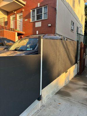 Dried concrete on my fence.  Removal left damage on a new surface which they refused to retreat.