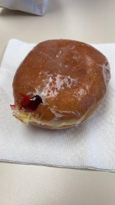 Raspberry filled glazed donut