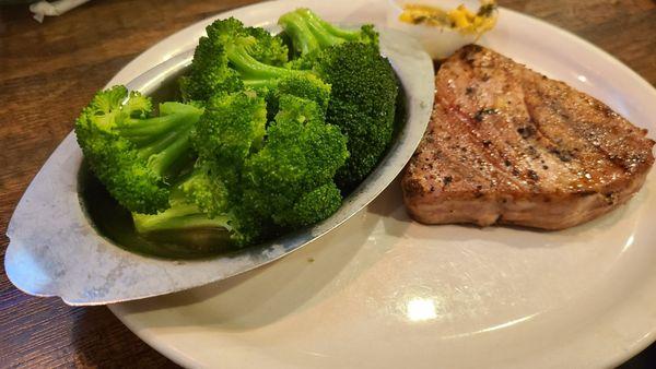 Ahi Tuna Steakserved with broccoli and salad.