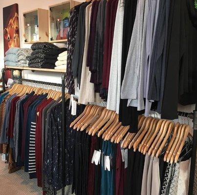 A wall of comfy, stylish clothing