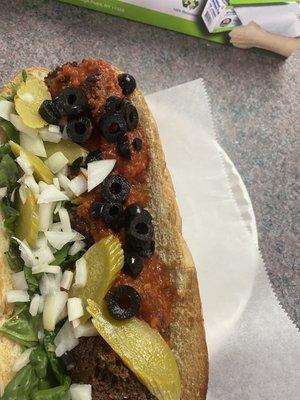 Get this Falafel sub (Germain special)  it has no meat marinara sauce, spinach, olives, onions and pickles....yum