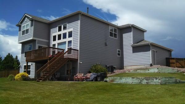 Replaced the old inadequate  gutters and downspouts, refinished the deck and replaced window screens.