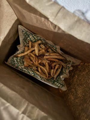 Fries uncovered on top of delivery bag.