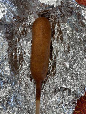 A  happy camper corn dog's back