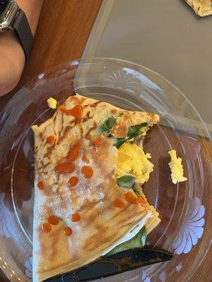 Scrambled breakfast crepe with sausage