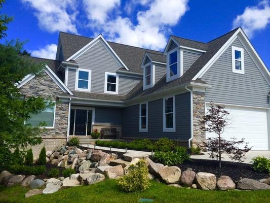 New siding, gutters, roof and cultured stone in Clarkston