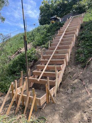 Building process of outdoor stairs on a slope.