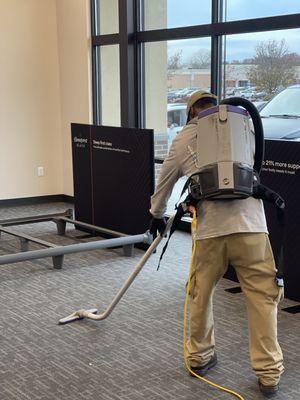 Vacuum up all the loose particles and dust from the floor