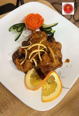 Orange Chicken - Strips of all white meat chicken sautéed in an aromatic sauce of dried peppercorns & orange peels.