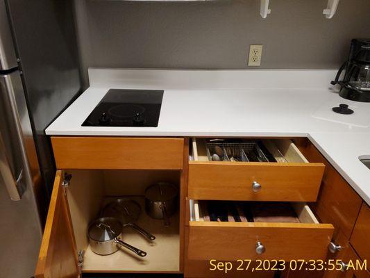 Stove top with pots and frying pan.