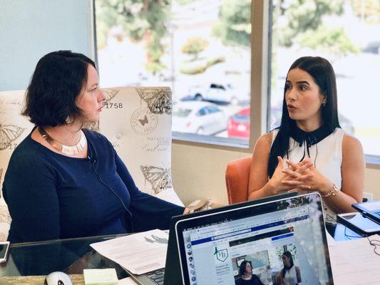 Immigration attorney Hadley Bajramovic and paralegal Ruth during a Facebook Live session.