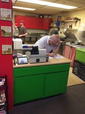 Dedicated staff taking orders - open kitchen.