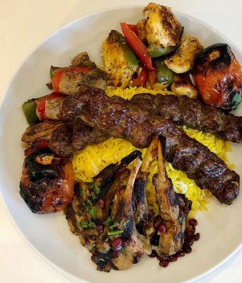 Lamb chops, saffron rice, grilled tomatoes, lamb koobieh, chicken kebab, beef shish kebab