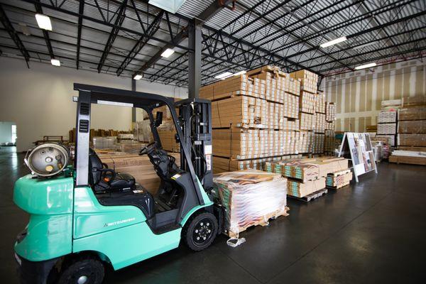 Really Cheap Floors Orlando forklift with inventory.