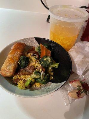 Beef & broccoli serving with egg roll and egg drop soup in background.