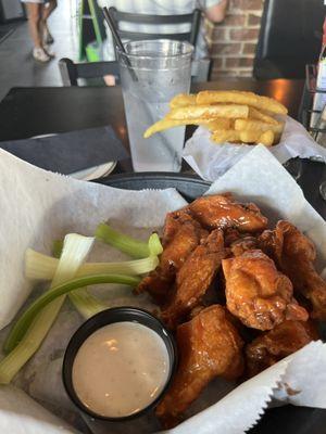 Hot Buffalo wings and fries