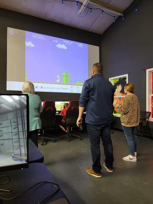 Big screen for 4v4 Smash Bros, retro gaming, or music for the dance floor