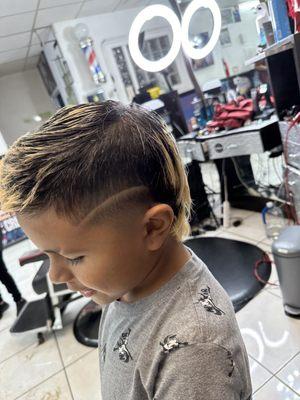 Modern mullet coming in hot! Just in time for his baseball season Liz always does a great job and always takes care of our lil man!