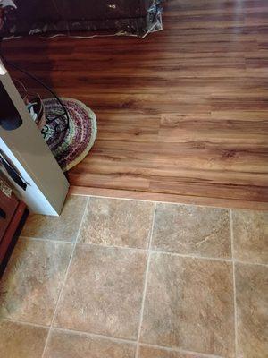 Threshold transition to vinyl flooring