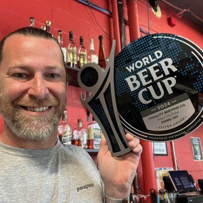 Tony, proudly showing off our 2024 World Beer Cup award!