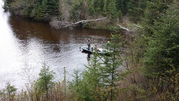 Fly fishing the Au Sable in front of the Lodge.