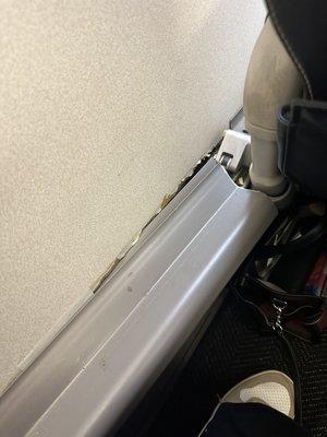 This is what United airlines calls first class. There is an actual hole... unacceptable.