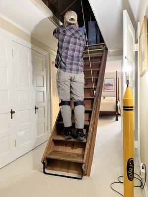 Tim inspects our crank down staircase and attic