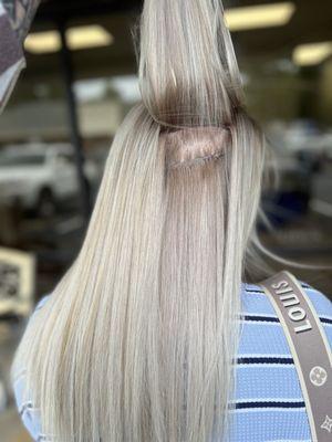 Hand-tied invisible Hair Extensions complete with Blonding color service done by Sandi Adams