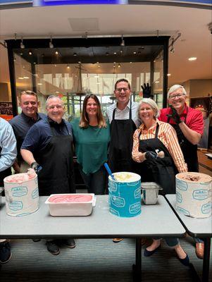 Arbella executives scooping ice cream to raise money for the Jimmy Fund Radio-Telethon.