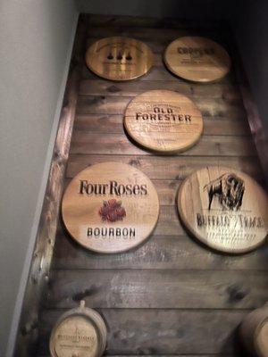 Awesome bourbon barrel head collection on the way down the stairs.