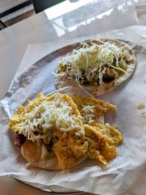 Breakfast taco in the front and puerco con verdolaga in the back