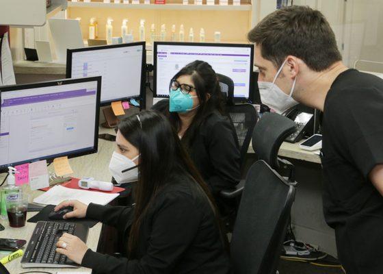 Front office staff at the check-in desk at The Dermatology & Laser Center of San Antonio