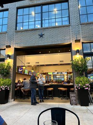 View from outdoor dining of the open garage door